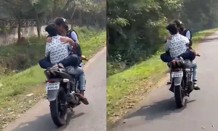 கட்டிப்பிடித்தபடி பைக் ஓட்டிய ஜோடி…. வெளியான வைரல் வீடியோ…. அதிரடி காட்டிய போலீஸ்….!!!!