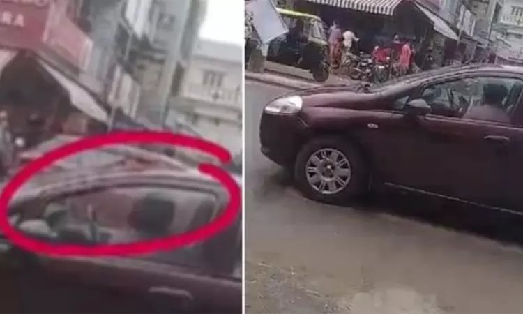 சாரல் மழை… நடு ரோட்டில் நின்ற கார்… திடீரென முத்தமழை பொழிந்த காதல் ஜோடி… வீடியோ வைரல்…!!!