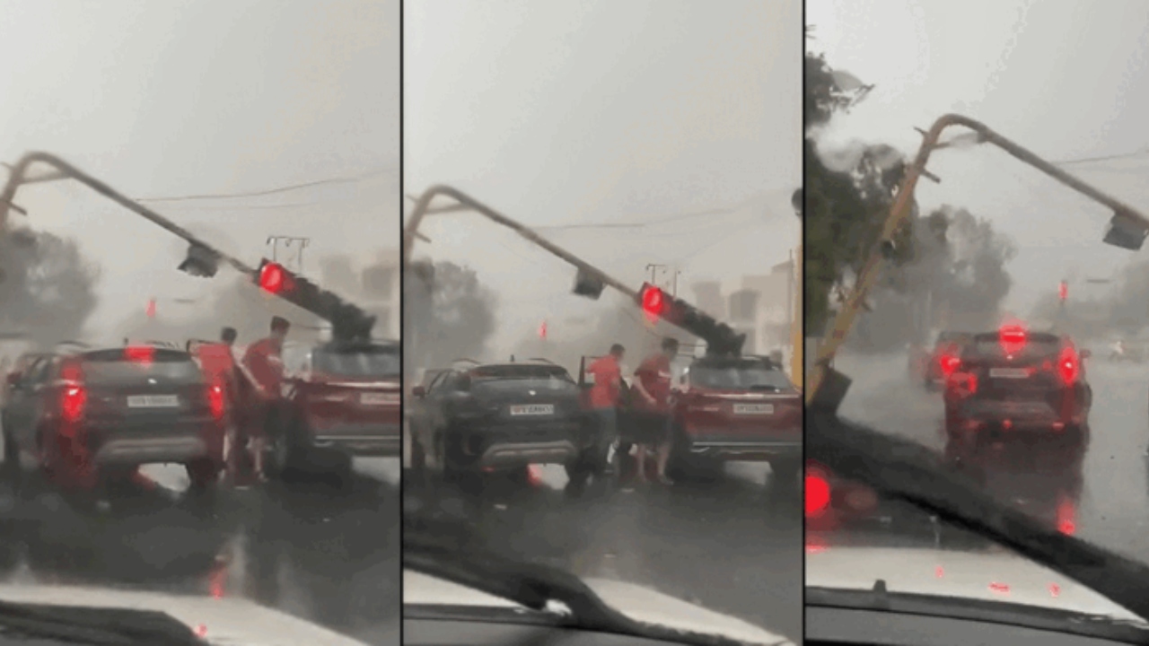 சுழற்றி அடித்த சூறைக்காற்று…! சட்டென முறிந்து கார் மீது விழுந்த கம்பம்… அதிர்ச்சியூட்டும் வைரல் வீடியோ….!!