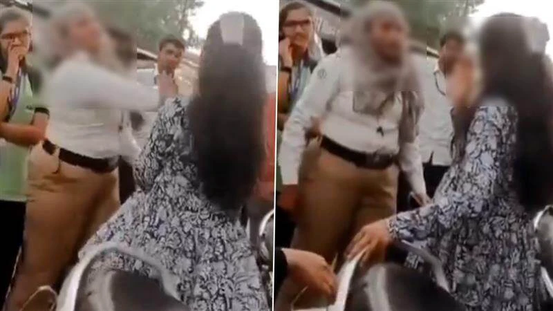 ஸ்கூட்டியில் சென்ற மாணவிகள்…! “கன்னத்தில் ஓங்கி அறைந்து….” நடுரோட்டில் ஆக்ரோஷமாக பேசிய போக்குவரத்து காவலர்…. வைரலாகும் அதிர்ச்சி வீடியோ….!!