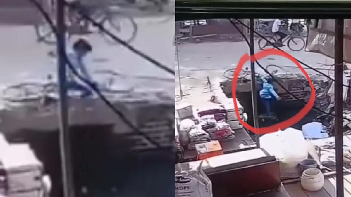 இது சாலை பள்ளமா..? இல்லனா குளமா…? சைக்கிளோடு தவறி விழுந்த பள்ளி மாணவன்… நொடி பொழுதில் உயிரை காத்த மக்கள்.. வைரலாகும் வீடியோ…!!!!