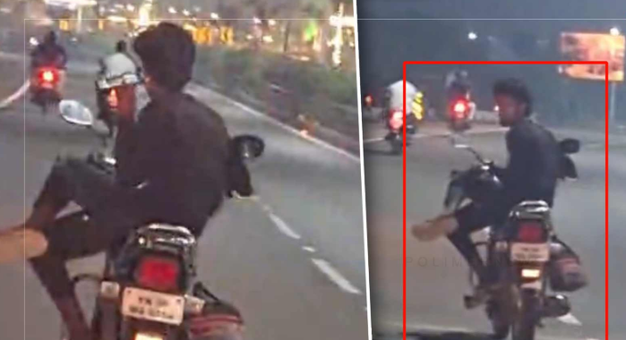 என்னப்பா நடக்குது இங்க? – வண்டில ஒரு பக்கமா உக்காந்துட்டு, போனை பார்த்துட்டே 3 கிலோமீட்டர்   ஆபத்தான பயணம்.. வாலிபரின் வைரல் வீடியோ..!!