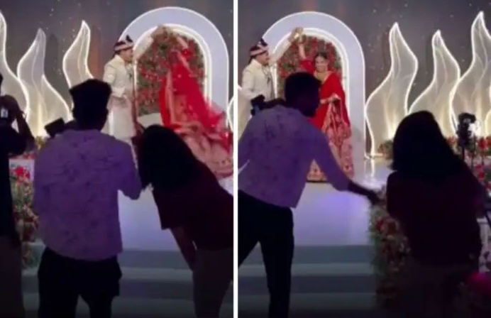 திருமண மேடையில் டூப்ளிகேட் போட்டோகிராபர்…! “டென்ஷன் ஆகி செல்போனை தூக்கி வீசிய கேமரா மேன்”… இந்த ரீல்ஸ் தேவையா..? கலாய்த்து தள்ளும் நெட்டிசன்ஸ்… வைரல் வீடியோ..!