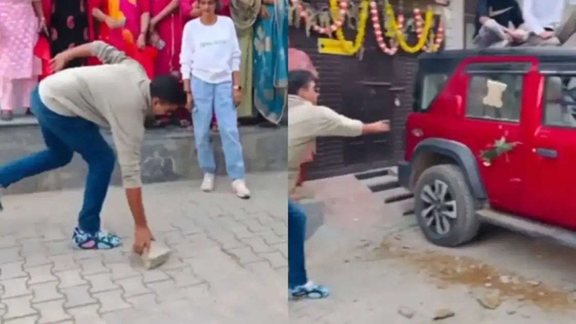 “ரீல்ஸ் பைத்தியம் முத்திருச்சு” Thar கார் கண்ணாடியை செங்கல்லால் உடைத்த வாலிபர்…. வைரலாகும் வீடியோ….!!